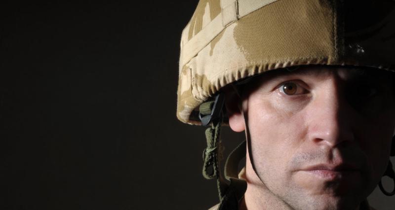 Close up of solider's face, half in shadow